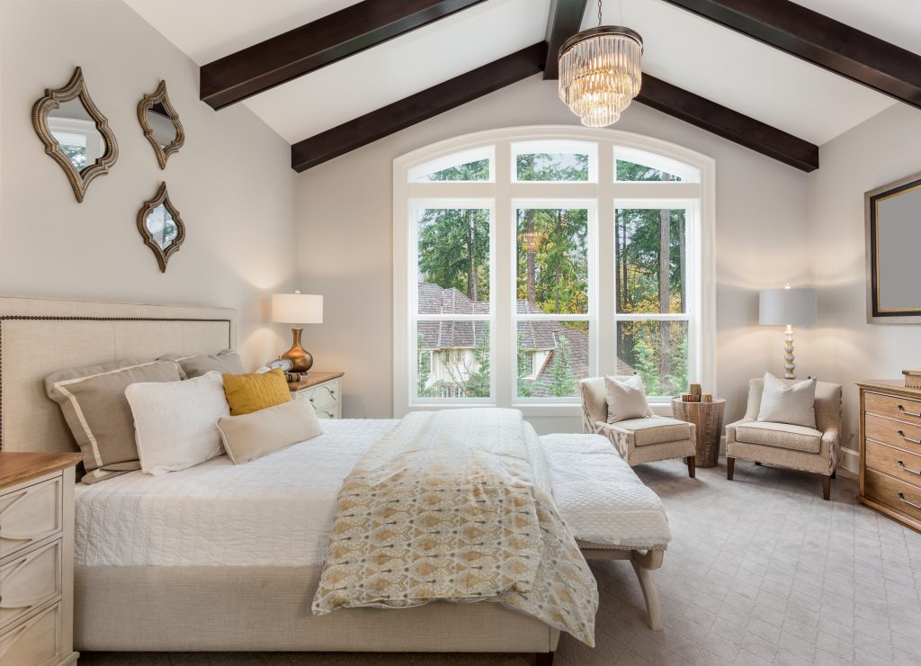 Beautiful furnished master bedroom interior in luxury home . Fea
