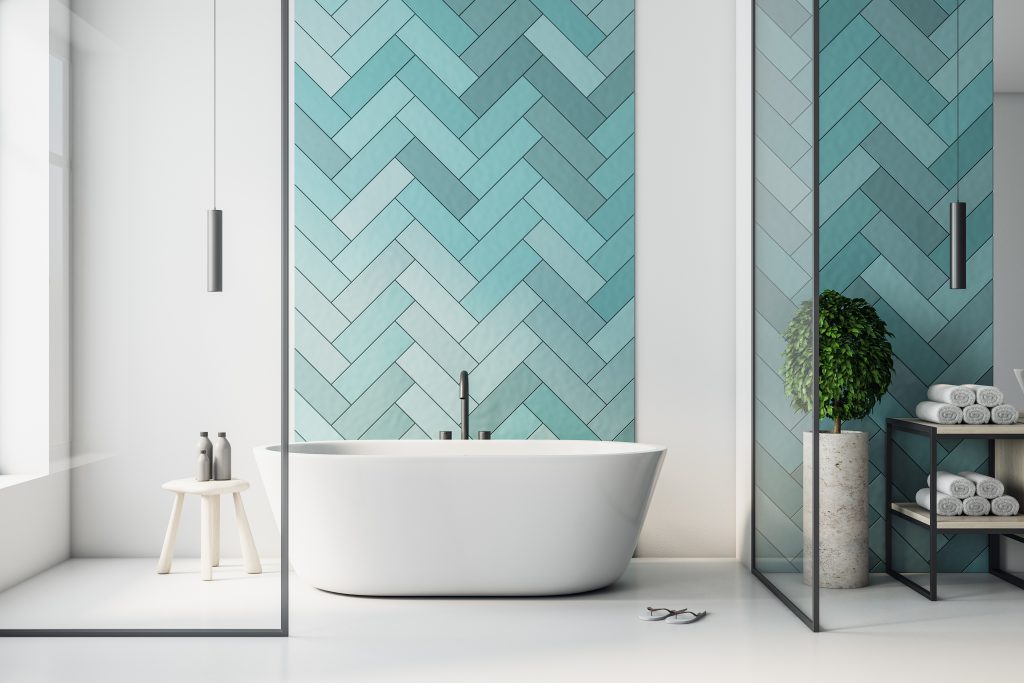 Modern turquoise bathroom interior with bathand self care produc